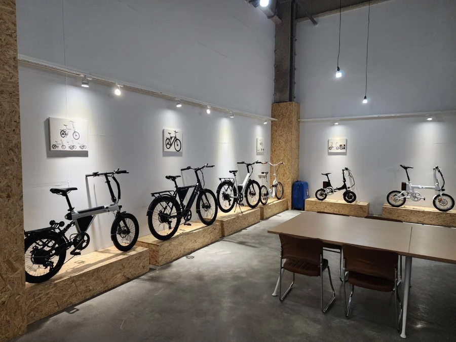 SLIDER showroom, with bikes displayed on wooden plinths